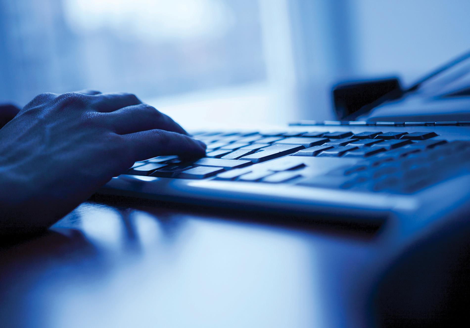 User typing on a keyboard